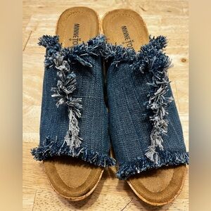 Minnetonka Blue Fringe Wedge Sandals